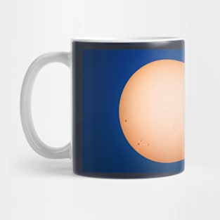 Sun and sunspots angainst blue sky Mug